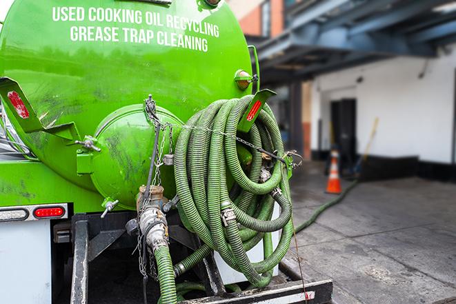 heavy-duty vacuum truck pumping out a grease trap in Campbell, CA